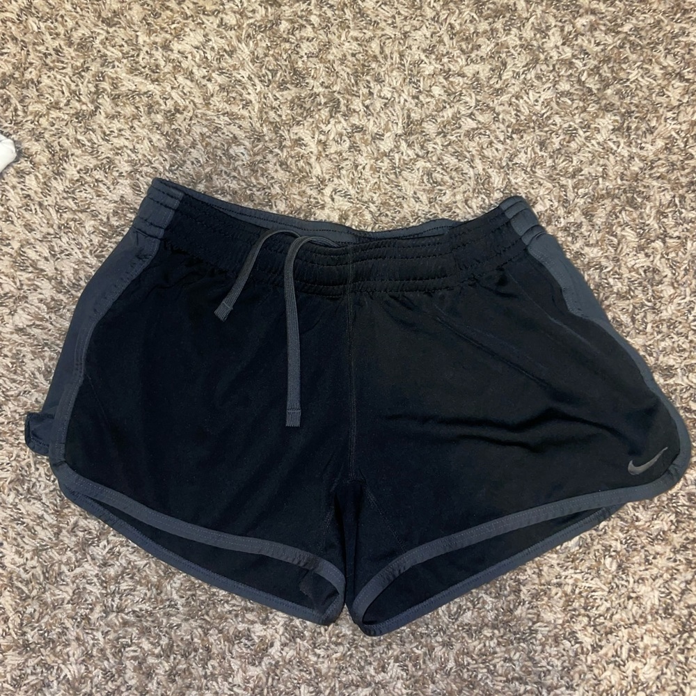 Black Nike athletic shorts with grey trim